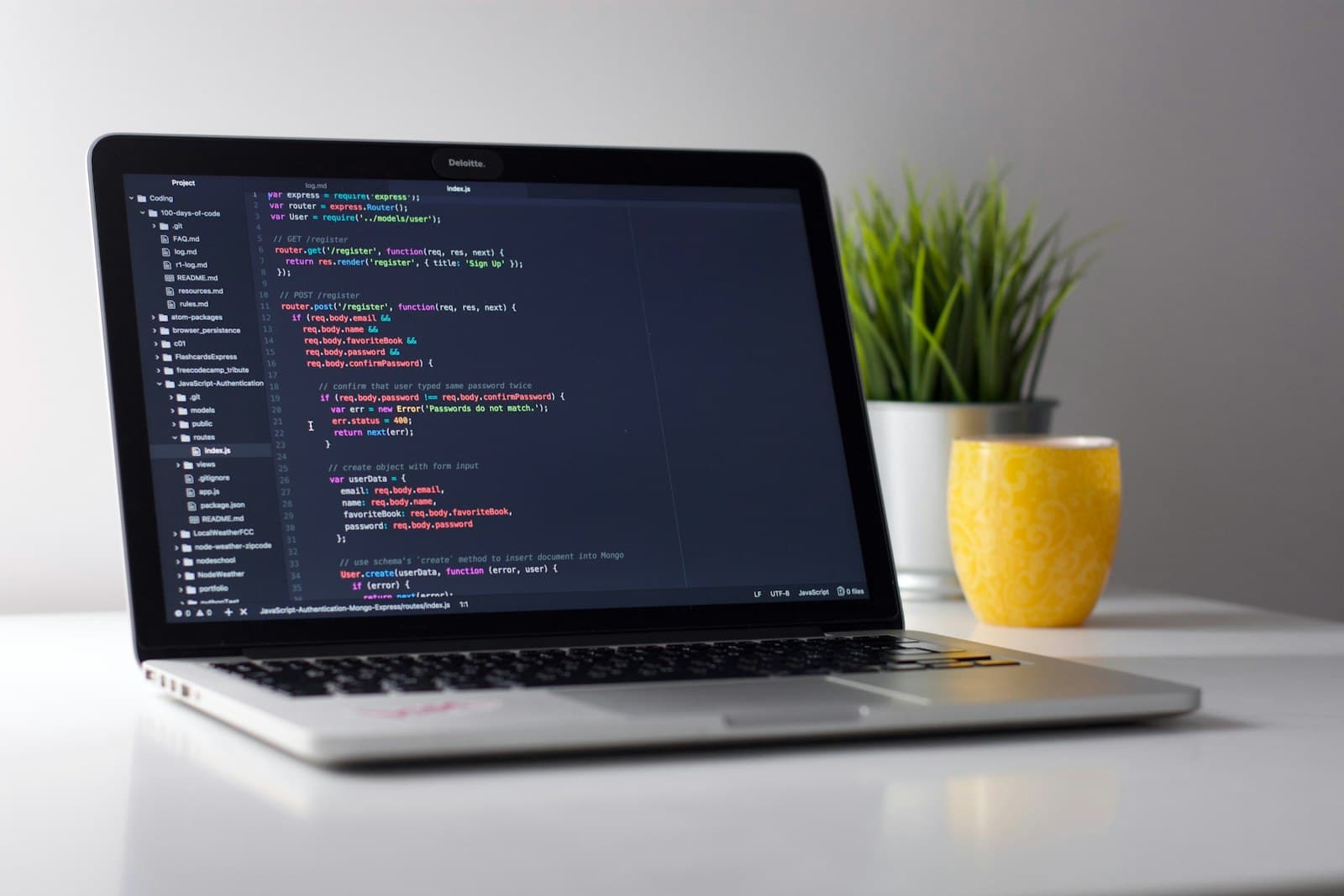 Developer coding LinkedIn API integration at workstation
